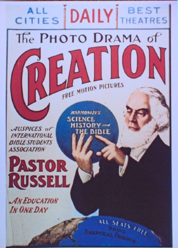 Poster for Photo-Drama of Creation, showing Pastor Russell and world.